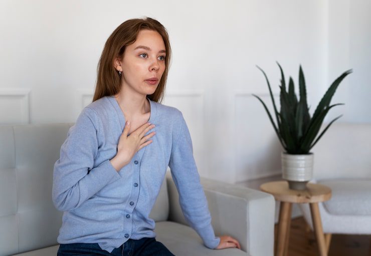 side-view-woman-breathing-home_23-2149450374